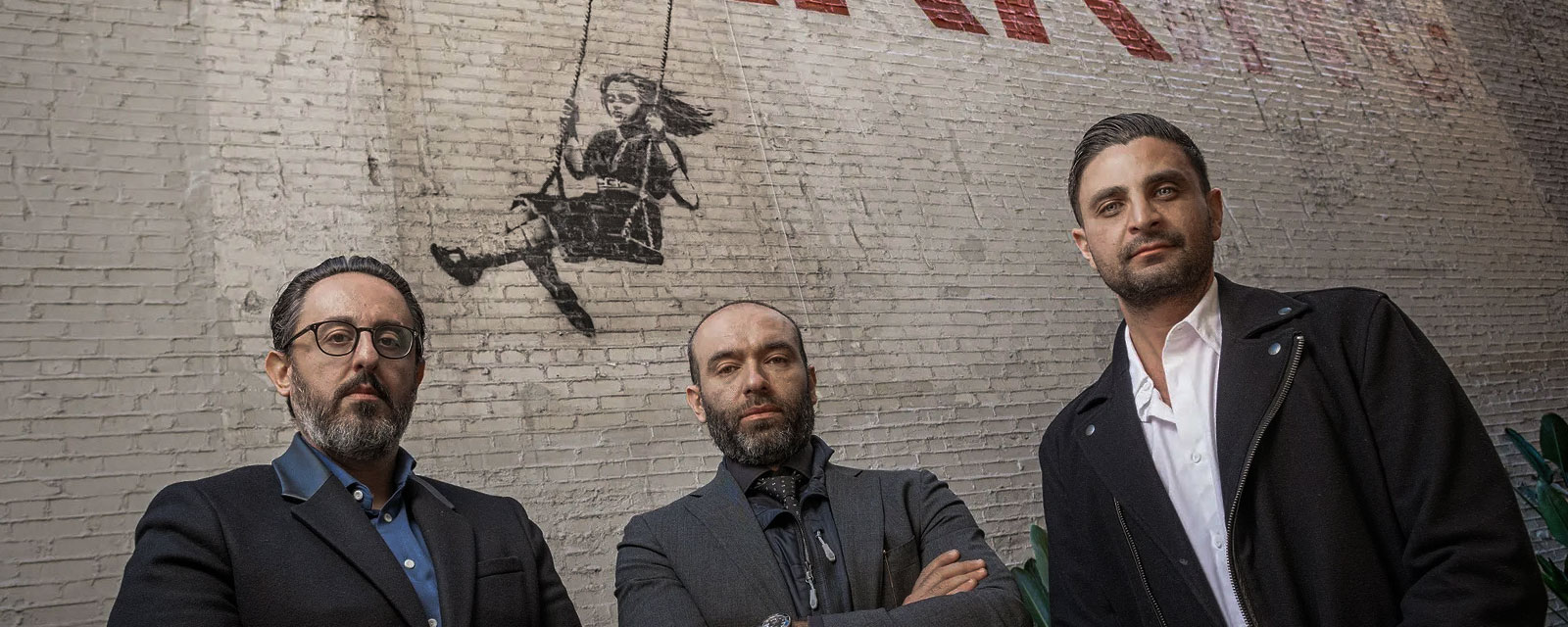 downtown la law lawyers buy building with a banksy painting in Los Angeles